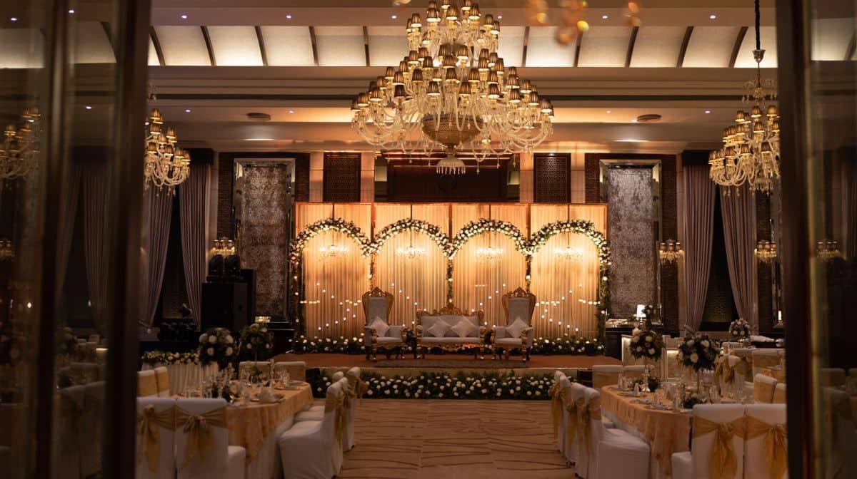 Banquet hall with chandeliers, stage and seating